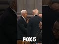 Mike Pence and Donald Trump shake hands at Jimmy Carter's funeral
