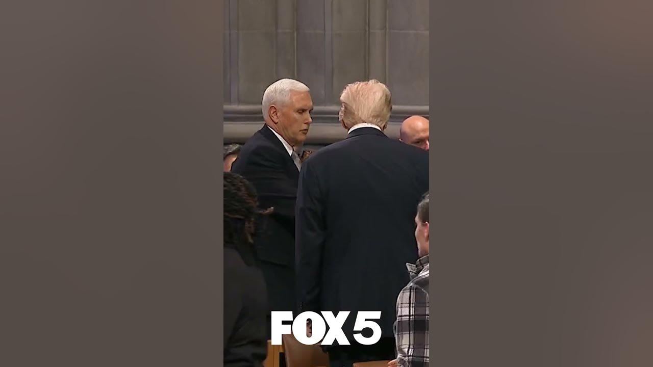 Mike Pence and Donald Trump shake hands at Jimmy Carter's funeral