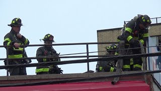 (FDNY Queens Box4463)   FDNY on scene of a 1075 All Hands Fire on the roof of a commercial