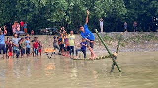 পানির উপরে তৈলাক্ত বাঁশে হাটার কঠিন চ্যালেঞ্জ। গ্রামের ছেলেদের মজার খেলা। Funny Game of Village Boys