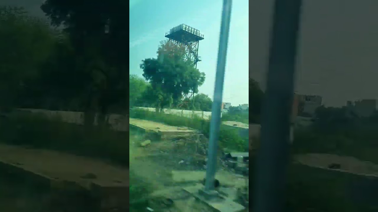 Departing from Asawati railway station at a very high speed.