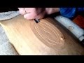 Carving a leaf design on a bowl bottom