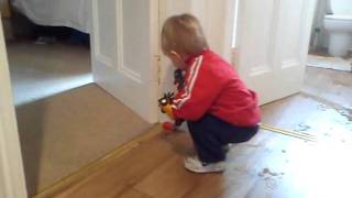 Toddler having trouble with his toys