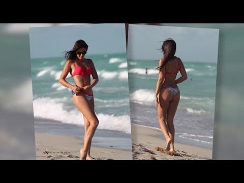 Claudia Romani Enjoys The Beach Despite A Near Wardrobe Malfunction | Splash News TV