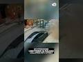 Scooter rider unbothered as building collapses into street