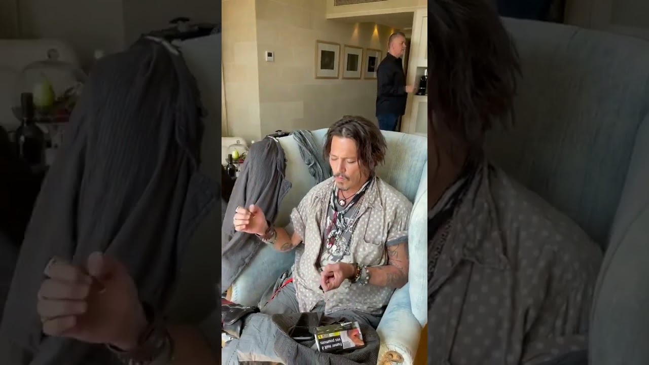 Johnny depp getting his hair done to attend bcn film festival