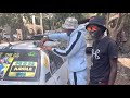 Militan of Mbogi Genje and Eastlando President inspecting Khaligraph Jones most expensive car