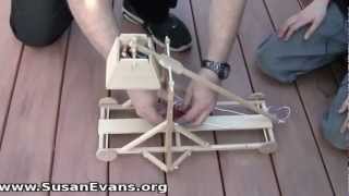 Watch my family play with a toy trebuchet.