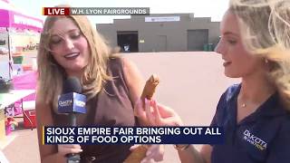 Baylee and Avery try fair food at the Sioux Empire Fair!