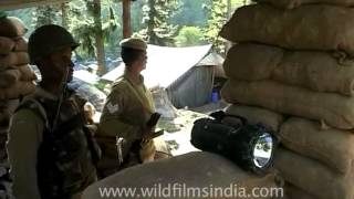Security forces behind sand bags, at Kashmir check-post