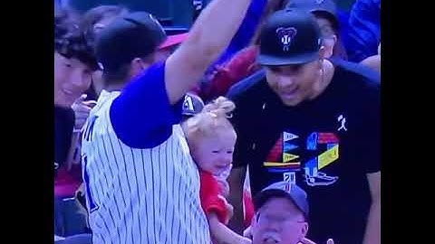Dad lets go of baby to catch a baseball and catches baby before she falls while saving his beer.