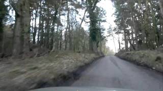Drive through Crook Horn wood to Webbers Post, Exmoor, Somerset, UK