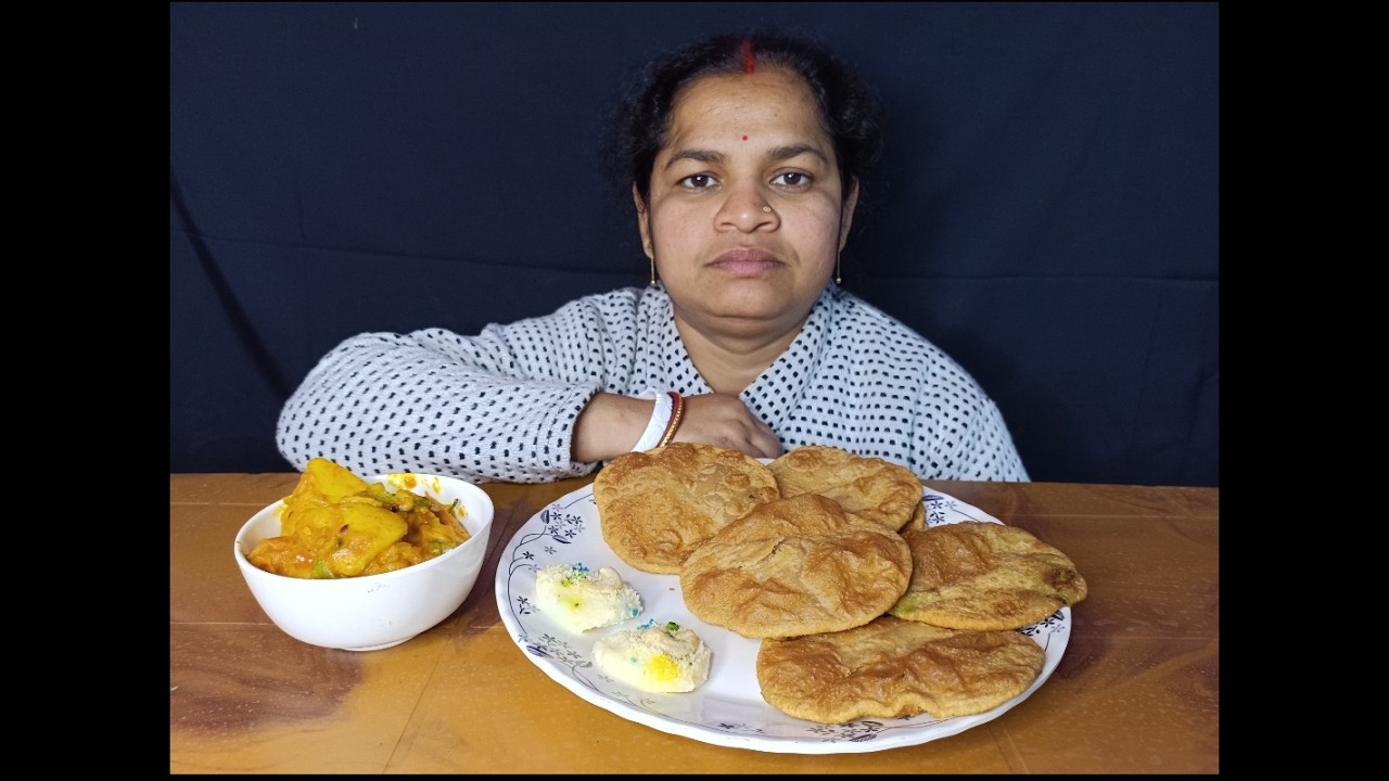 Basanti eating kadaisutir kachori, kashmiri dum aloo and swets