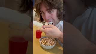 Man Eats Cheerios With Yogurt