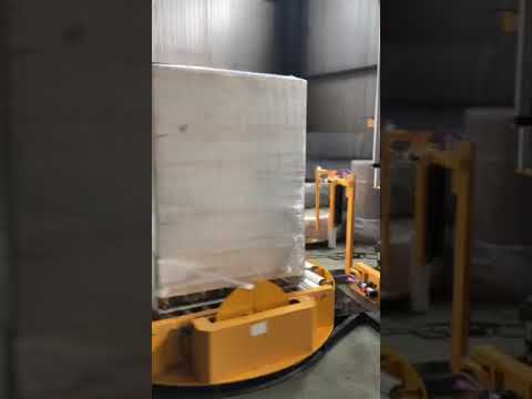 On-line pallet wrapper with top press