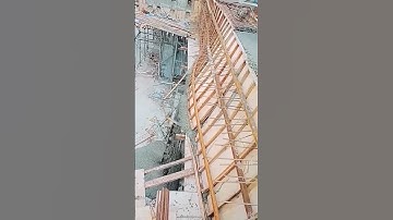 The process of pouring concrete into the formwork of a column- tools and machines make work easier