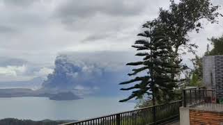 People view the erupting Taal volcano in Tagaytay City, Philippines