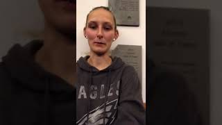 Girl Blowing Up A Red Balloon To Pop