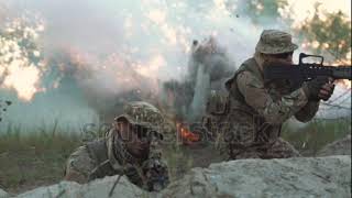 Slow motion of silhouette group of military men running on field in smoke and falling killed under