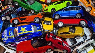 Various size model cars on top of each other