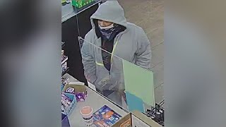Search continues for suspect who robbed cashier at gunpoint