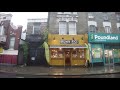 Heavy rain walk in Portobello Market in Notting Hill London on Sunday afternoon 25 July 2021