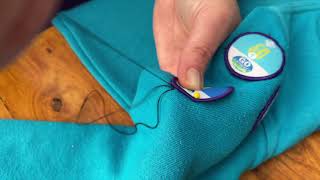 How to sew a badge onto your uniform.