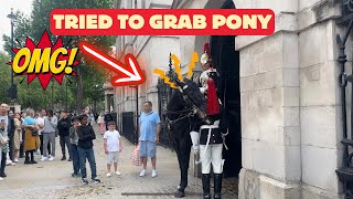 King's Guard Horse Tries to Bite Fellow Guard in Shocking Moment.