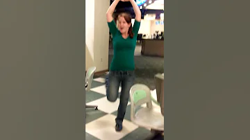 White girl dancing at bowling alley