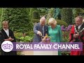 King charles and queen camilla cut crown cake in coronation garden