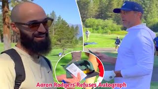 Aaron Rodgers refuses to give fan an autograph in confrontational exchange.