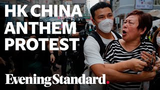 Hong Kong protest: police disperse huge crowds protesting China anthem bill