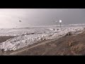 Surprise sneaker wave floods past car just parked