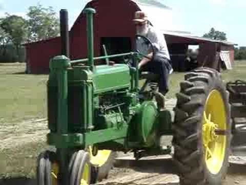 Carl Crock's 1937 John Deere A Pulling a Sled