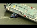 Stunning Image of Cargo Ship Carrying Luxury Cars Grounded