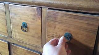 Impressive Chinese tapered apothecary cabinet constructed of elm and made with mortise and tenon joinery. Featuring eighteen 