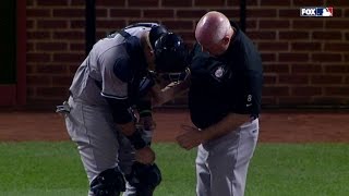 NYY@BAL: Romine injured warming up Chapman