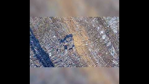 Truck Unloading Garbage,Waste at landfill,junkyard.Aerial view.