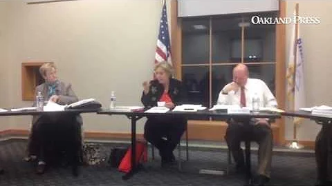 Patricia Salter goes over the library's savings ba...