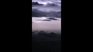 Thunderclouds seen from inside the plane　機内から見る雷雲