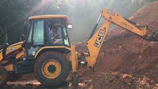 jcb 3dx digging and gathering soil