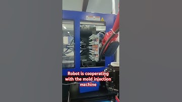 Robot is cooperating with the mold injection machine #automobile #borunte