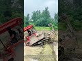 Traversing Field Ridges: Tracked Farm Tiller Crosses Earthen Berms To Cultivate Separate Paddy Plots