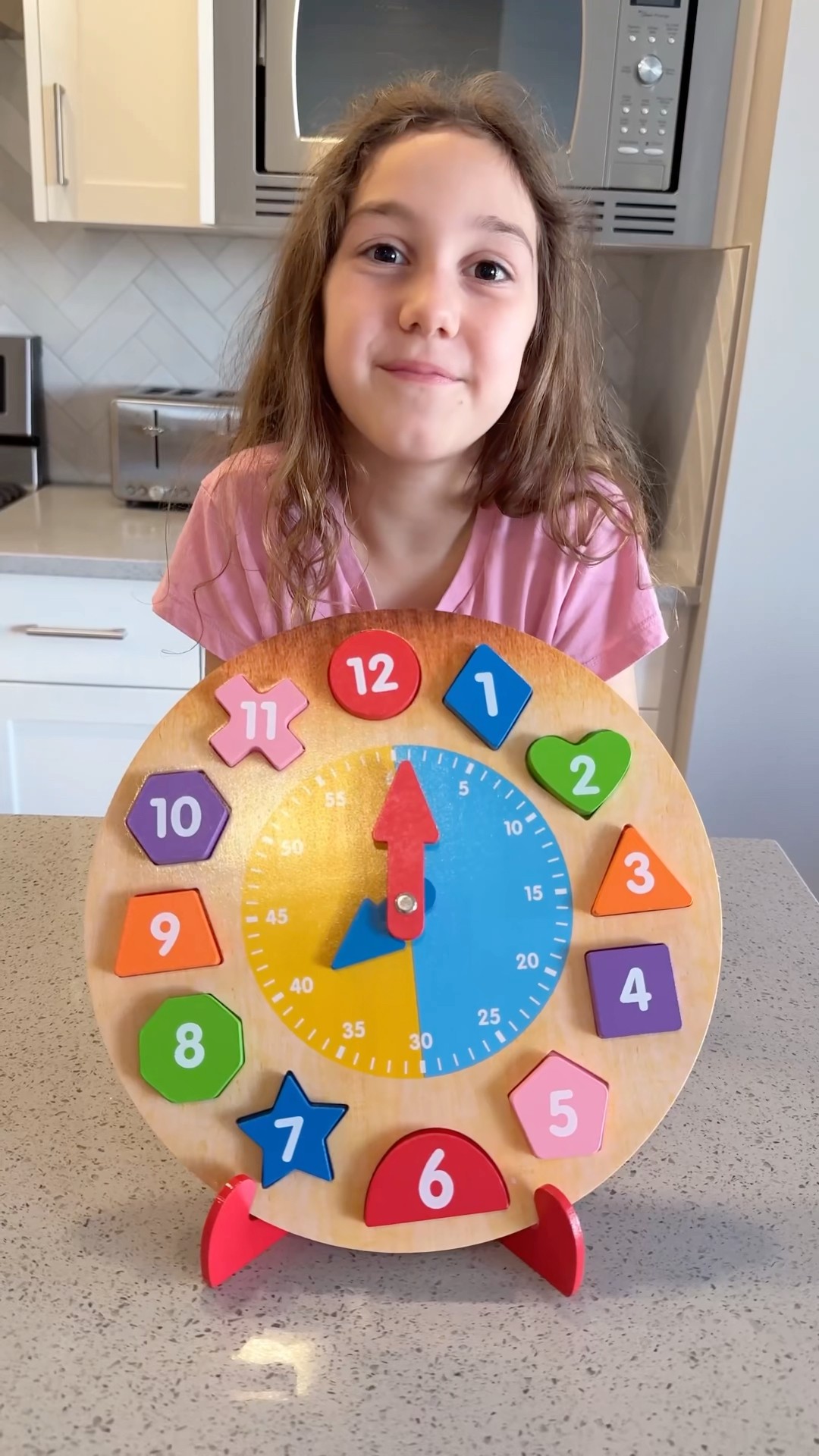 Sierra teaches Rhia how to tell time and be independent