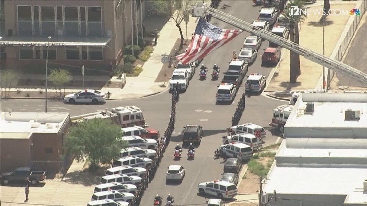 RAW: Honor guard escorts body of Phoenix police Officer Paul Rutherford ...