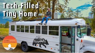 He built a $35k TechFilled Tiny Home Skoolie to live a full life!