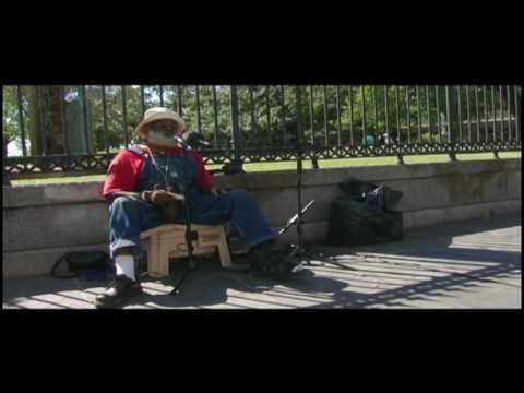 www.playingforchange.com Grandpa Elliott shares his version of Fannie Mae from Jackson Square in New Orleans. We met Grandpa Elliott on the corner of Toulouse and Royal Street in the French Quarter, his patented spot for performing. However, on this morning, there was some street construction happening which made it difficult for recording. So, we trudged our gear through the streets of the Quarter and found a quiet spot in the famous surroundings of Jackson Square. Slowly people gathered in curiosity and fascination while Grandpa warmed up his voice and before long we were in record and capturing this amazing performance.