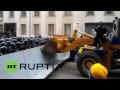 Ukraine: Protesters throw flares as a digger is driven through police barricade