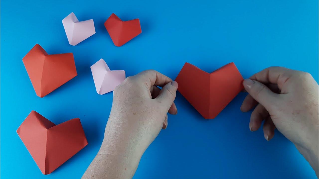 Объемные сердечки. Сердце из бумаги. Оригами сердце объемное. Как сделать сердечко из бумаги видео. Оригами сердце.