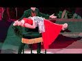 Circus magician and lady in red